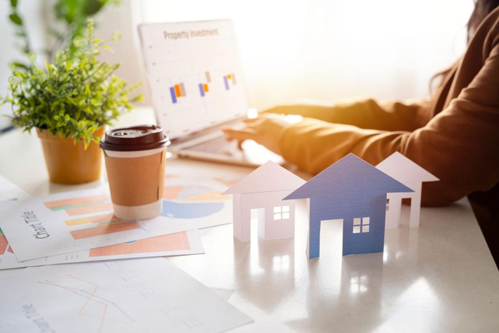 Analyzing Real Estate Investment on Laptop